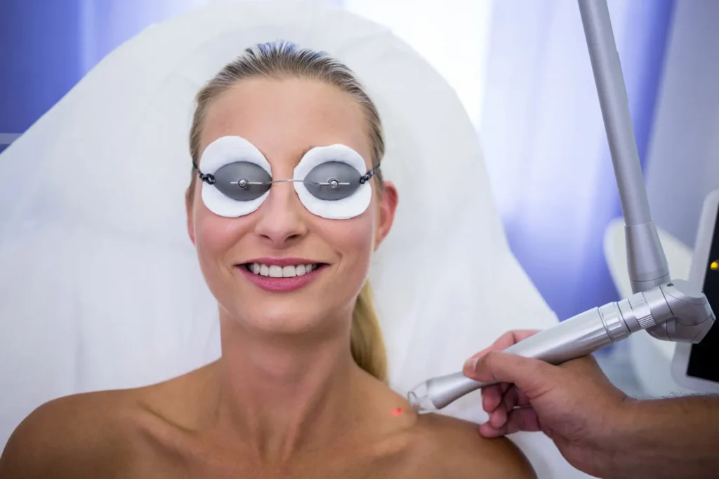 Smiling client after a facial laser treatment
